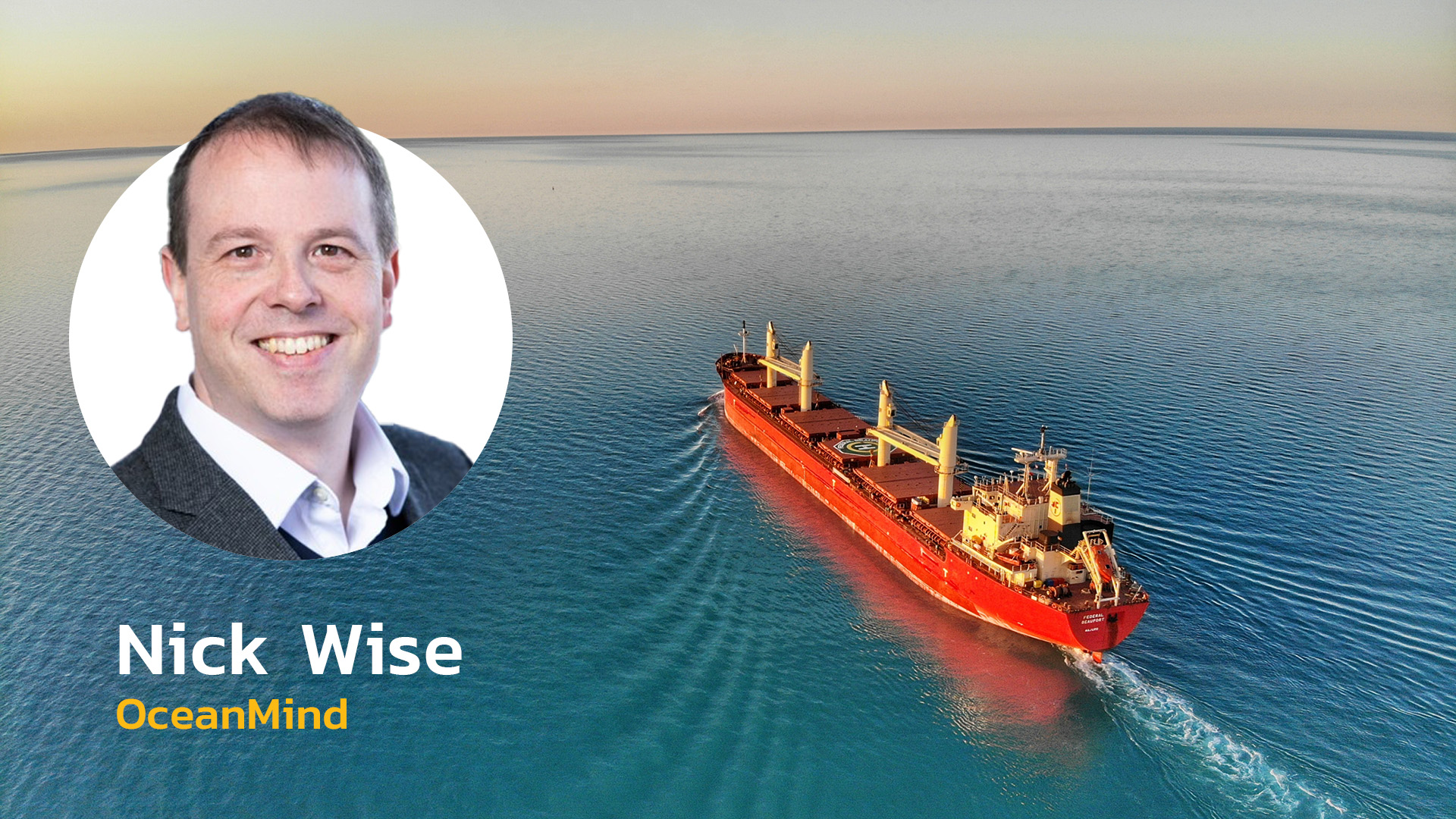 Headshot of OceanMind CEO Nick Wise over a ship cruising on the ocean