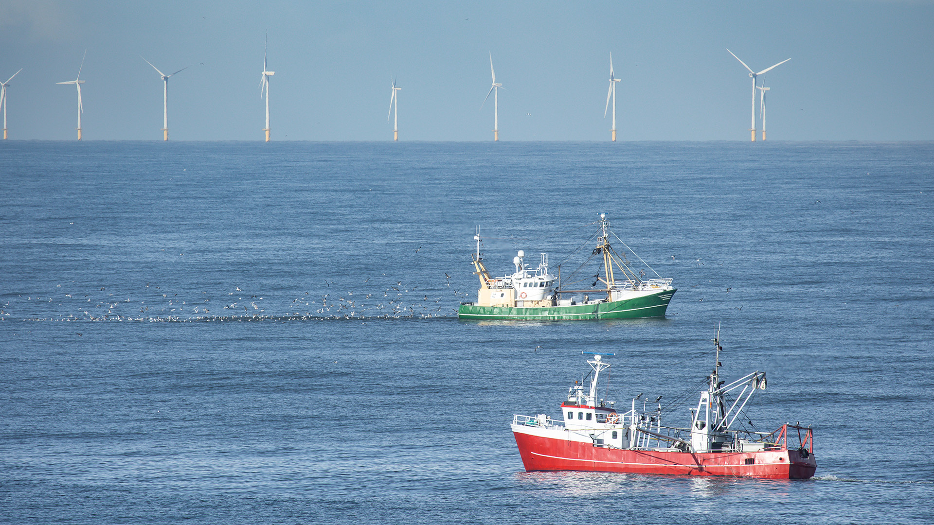 Two fishing cutters pass each other in the North Sea