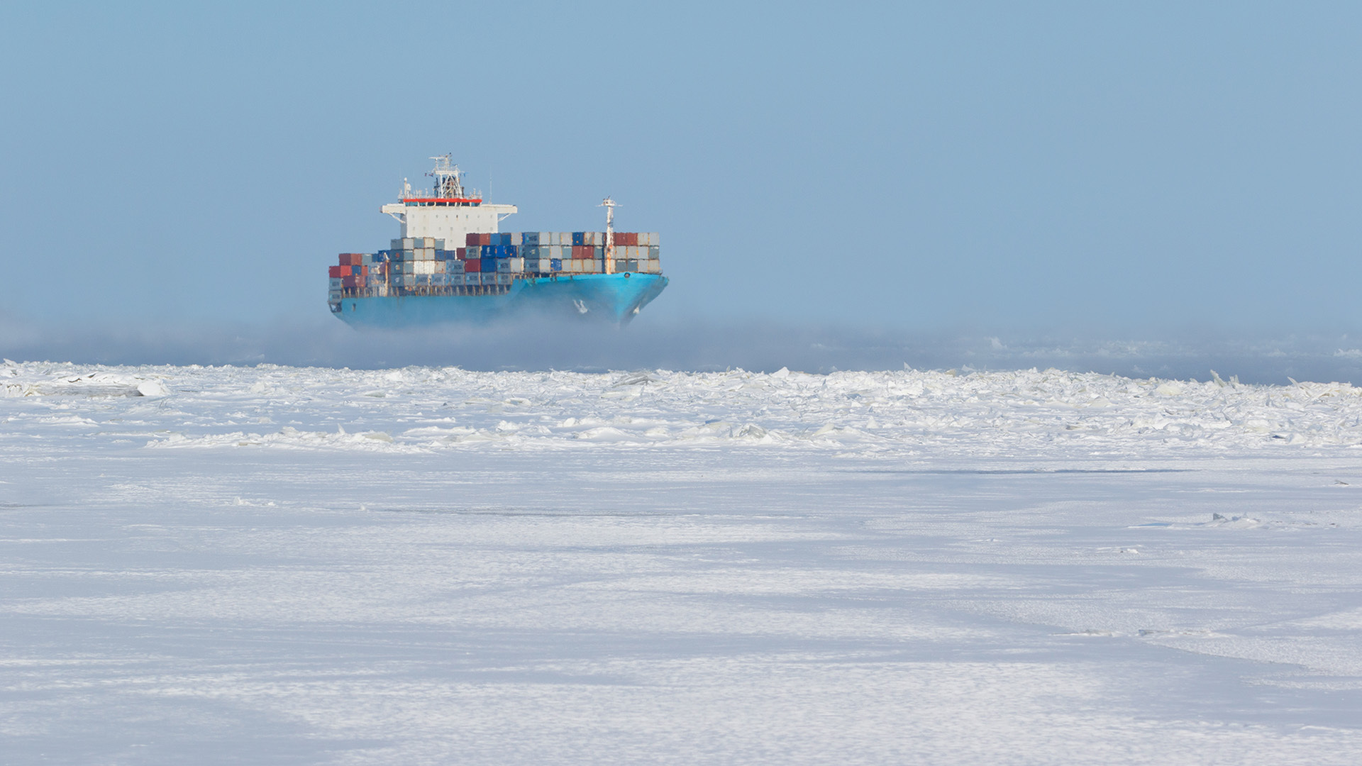 Container ship passing through the Arctic