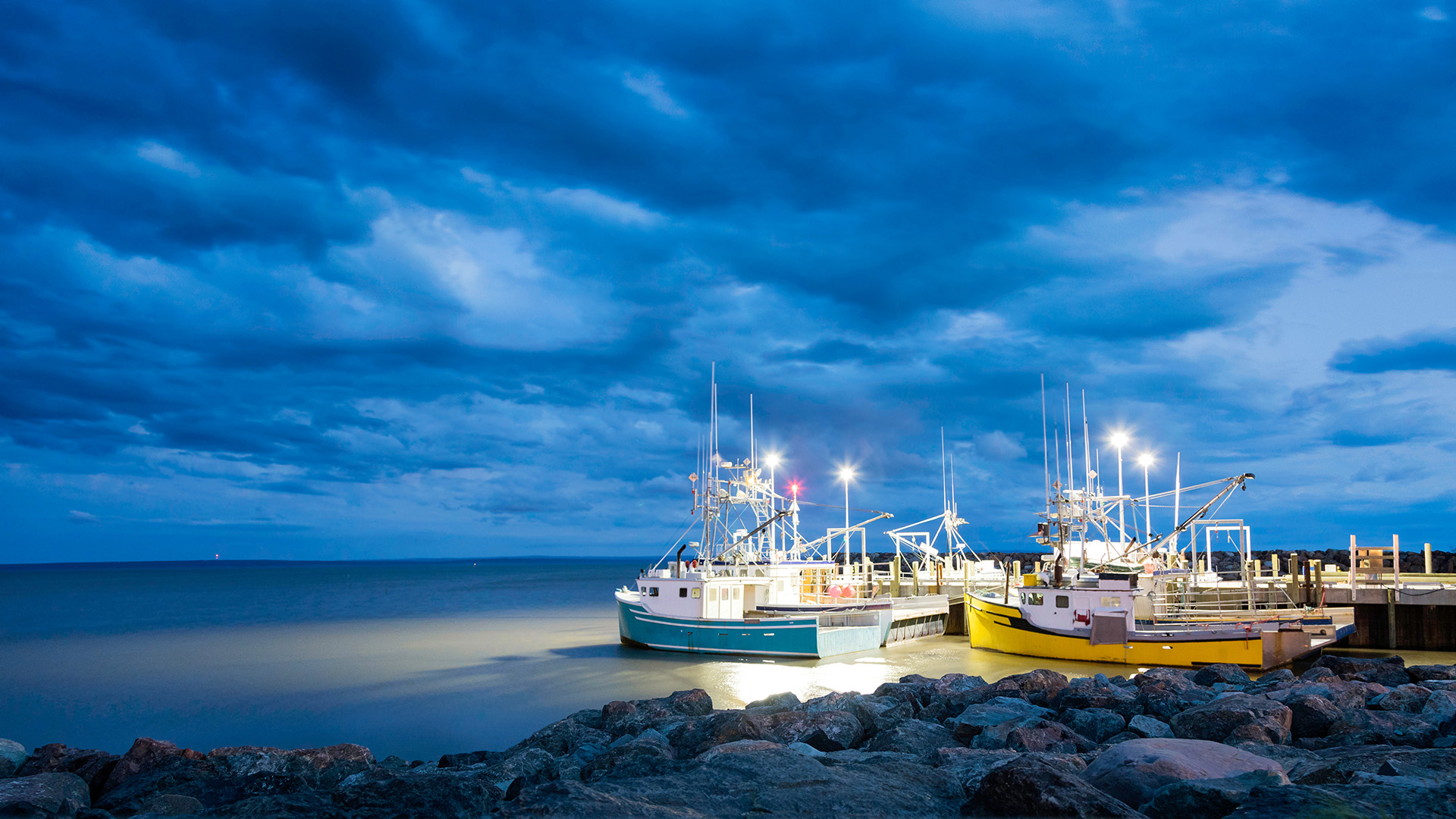 A fleet of fishing boats at night on Canada's Bay of Fundy
